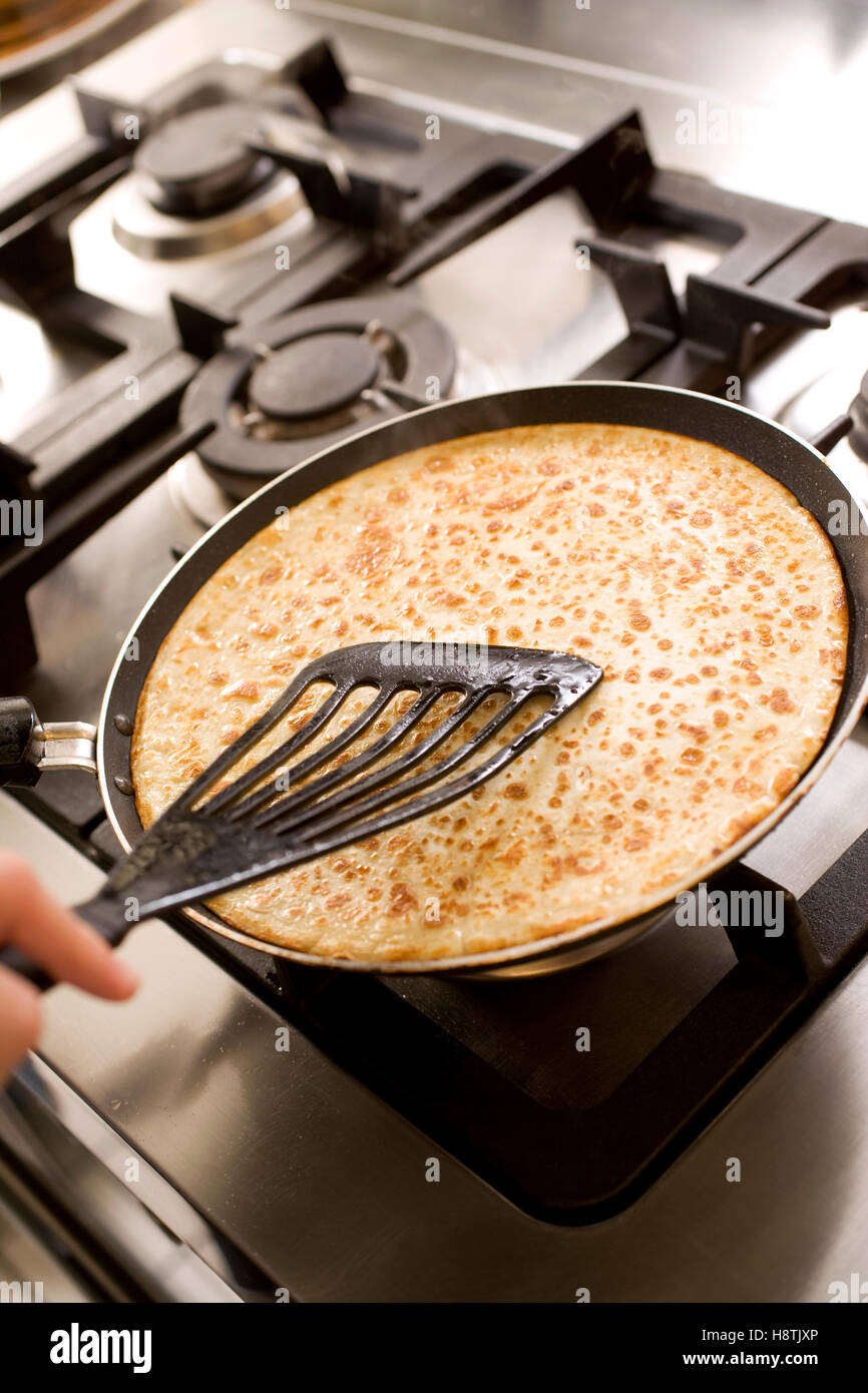 pancakes cooking on the hot stove Stock Photo Alamy
