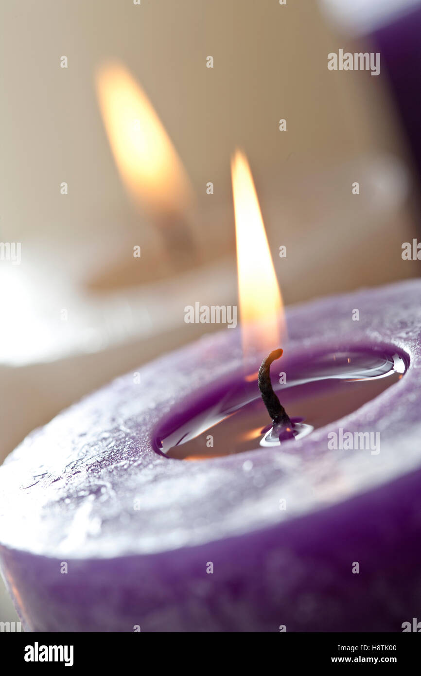 close up burning purple candle Stock Photo Alamy