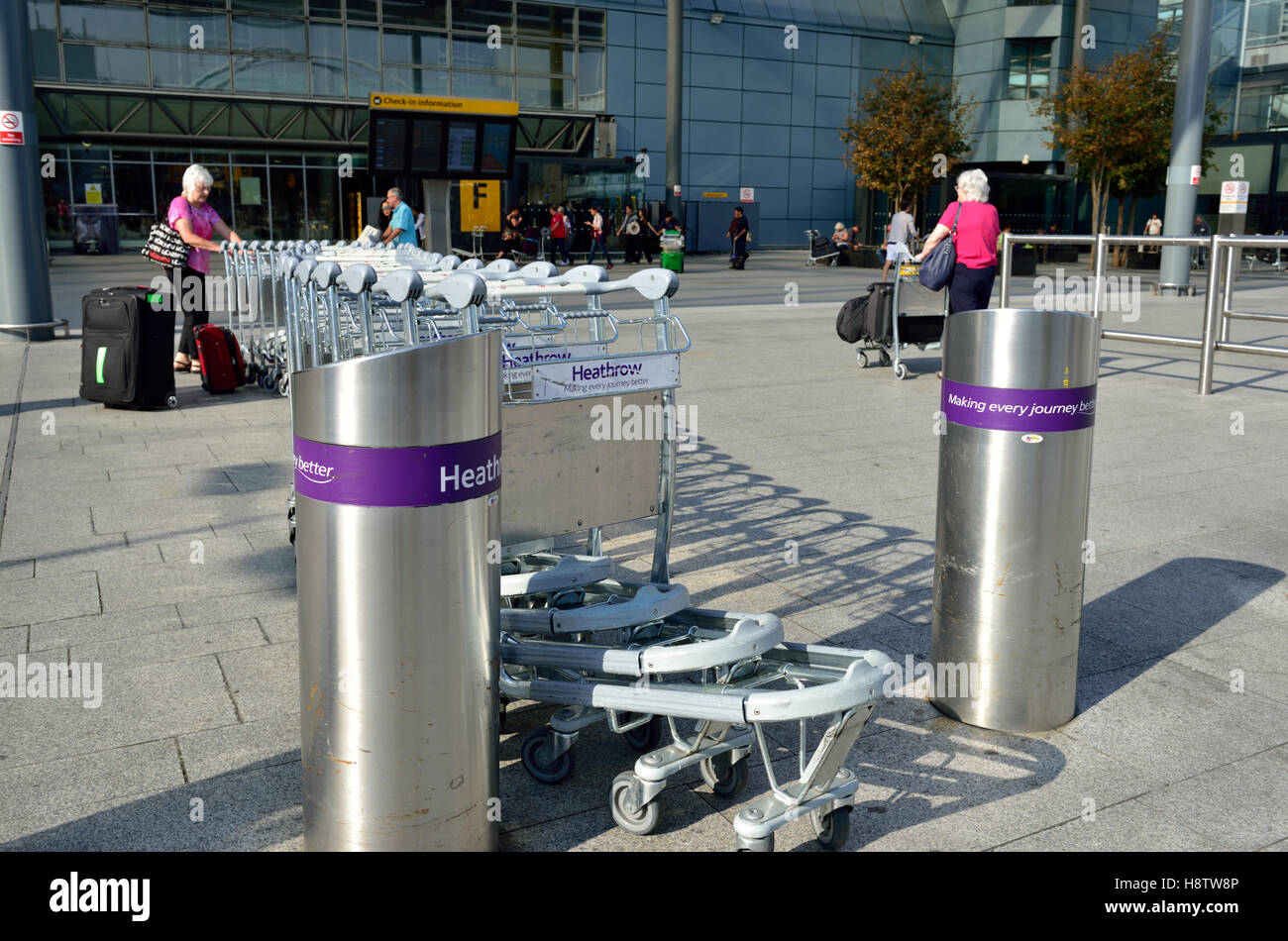 Heathrow airport terminal 3, collection point for baggage trolleys, London, Britain, UK Stock Photo
