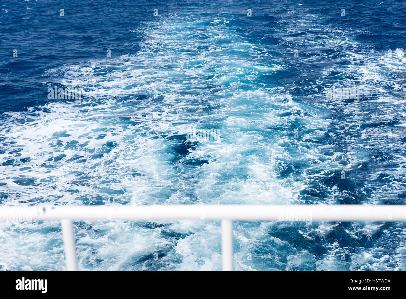 View of ship's wake from the yacht through handrail Stock Photo Alamy