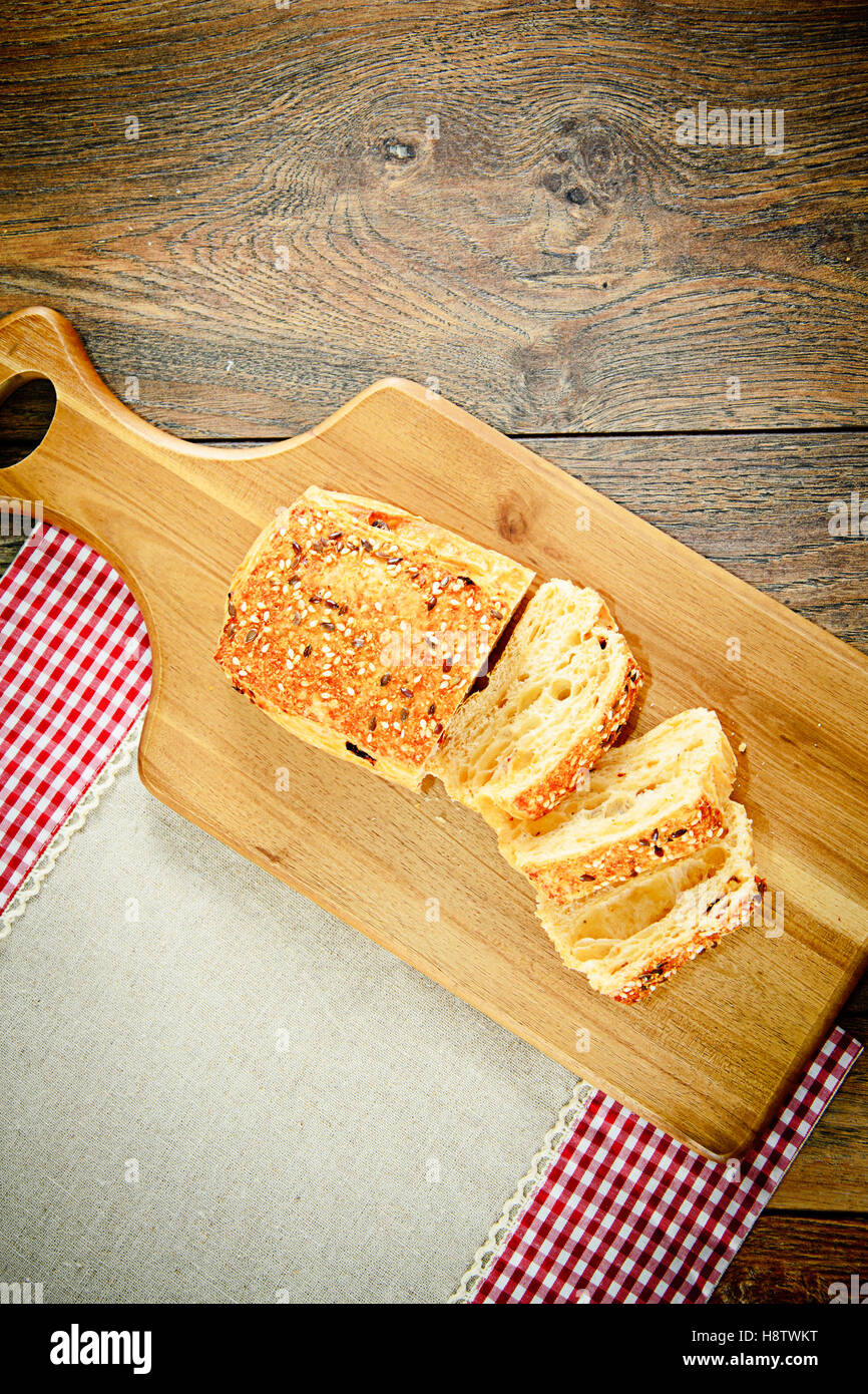 Sliced Bread with Sesame Seeds on a Wooden Board Stock Photo - Alamy