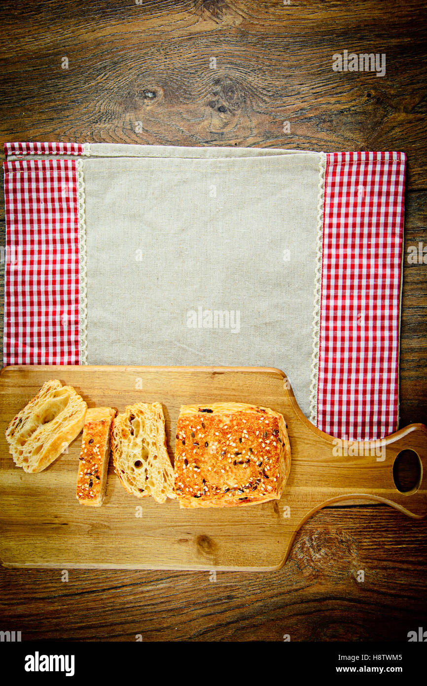 Sliced Bread with Sesame Seeds on a Wooden Board Stock Photo - Alamy