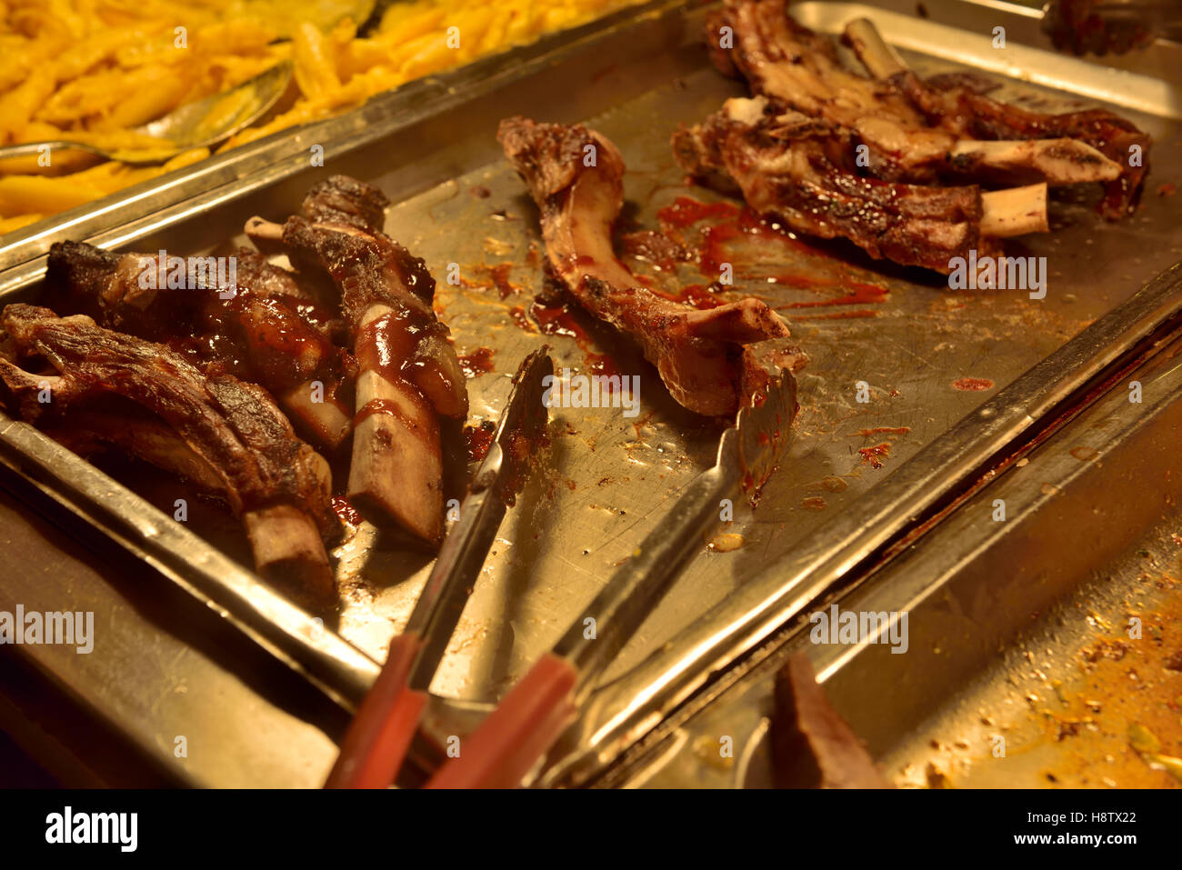 Ribs buffet selection in “all you can eat” restaurant Stock Photo