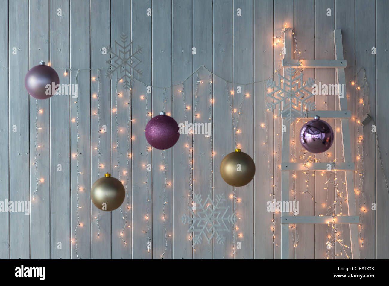 Christmas lights burning on a white wooden background Stock Photo Alamy