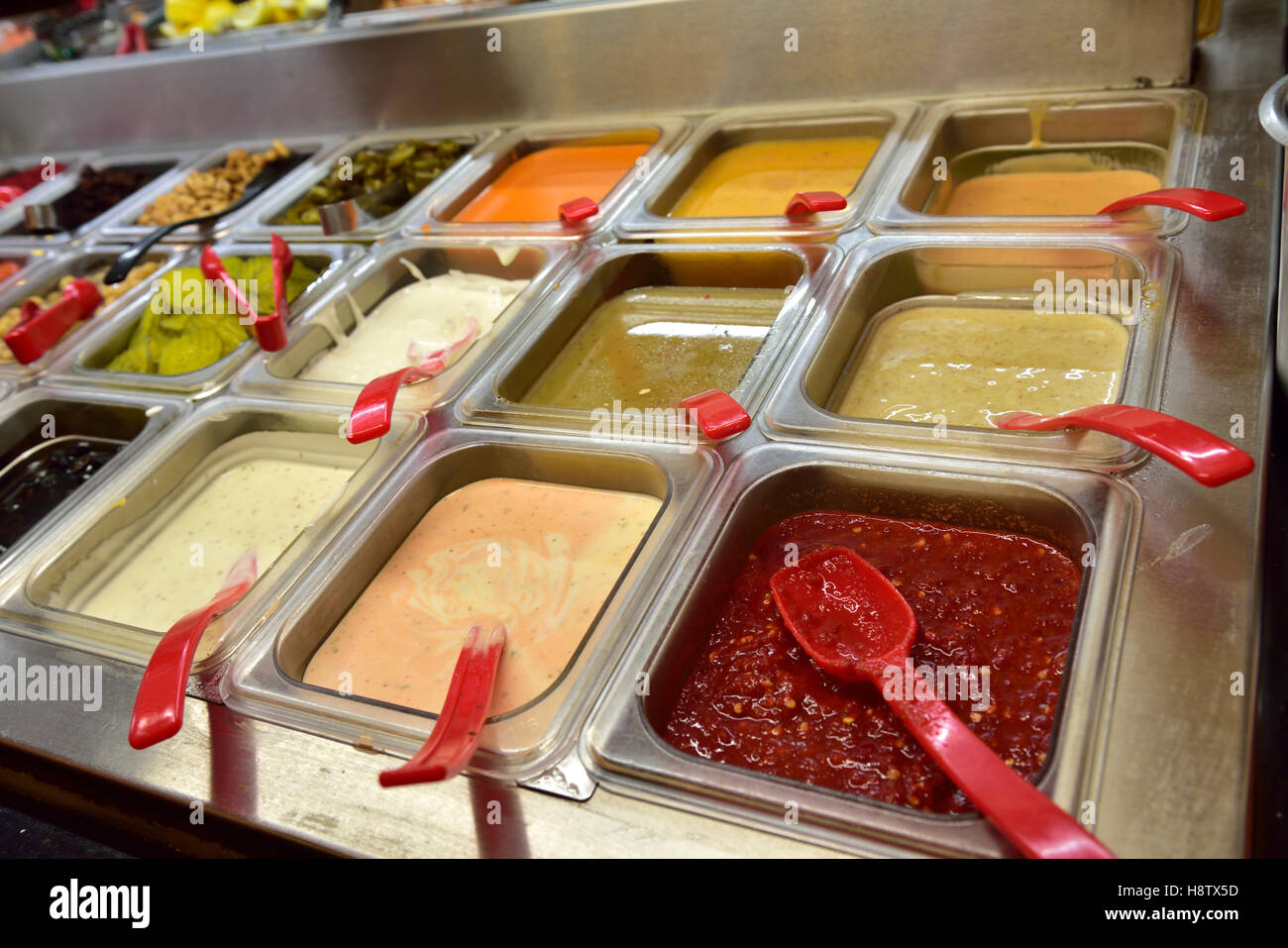 Dressings and sauces in “all you can eat” restaurant Stock Photo
