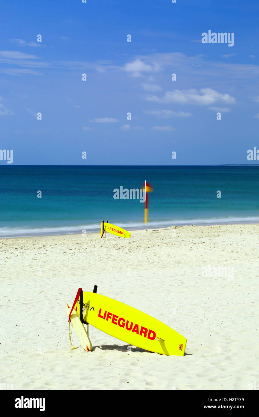 Surf lifesaving lifeguard equipment at the ready on the sand at Kings Beach in Caloundra