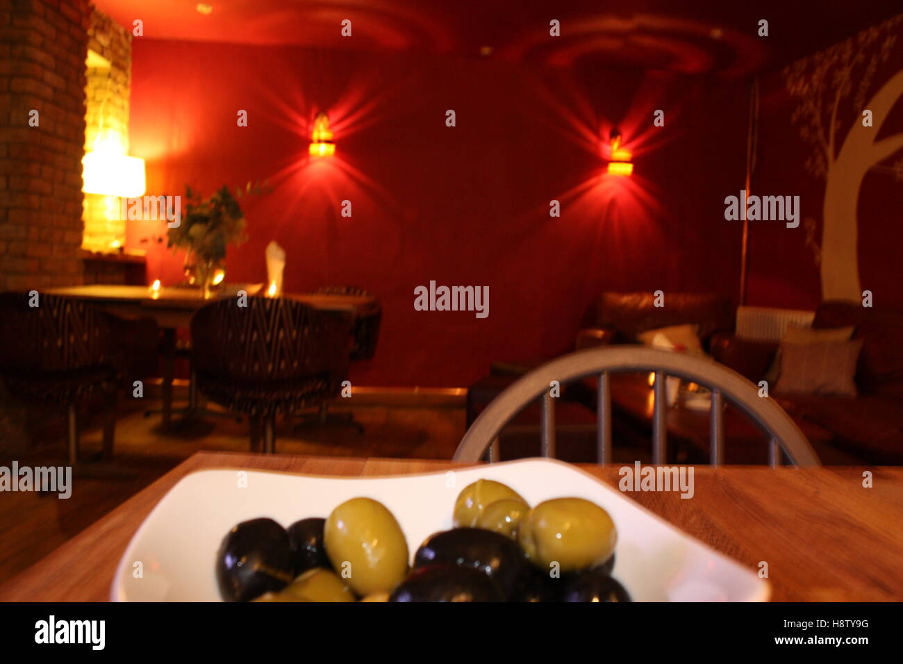 Olives in a pub / dining room setting Stock Photo