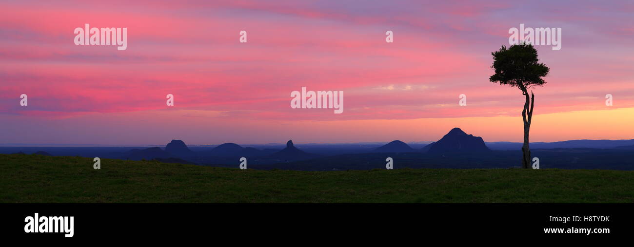 A sunset panorama over the spectacular Glass House Mountains, viewed from Maleny on the Sunshine Coast, Queensland, Australia. Stock Photo