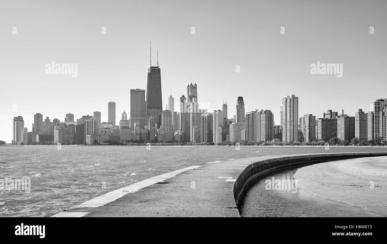 Black and white photo of Chicago city skyline seen from pier on Lake Michigan, USA. Stock Photo