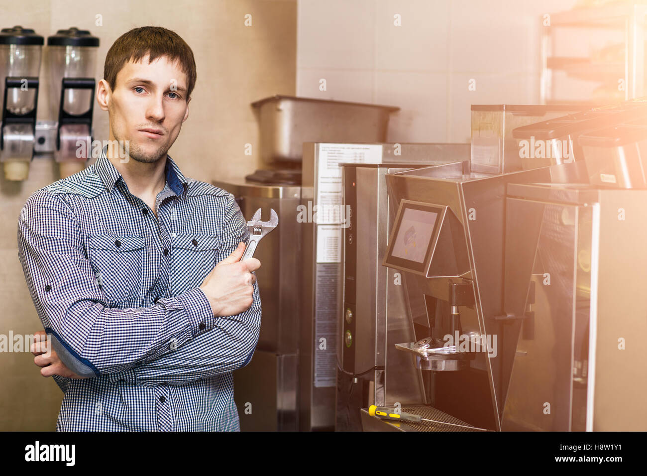 Man going to repare coffee machine Stock Photo - Alamy