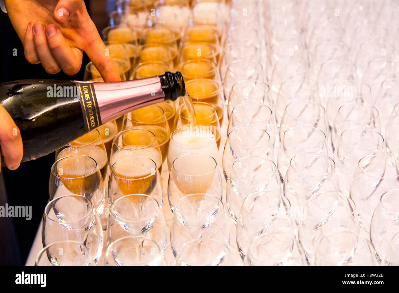 Champagne glasses, filled for the guest of an event, Stock Photo