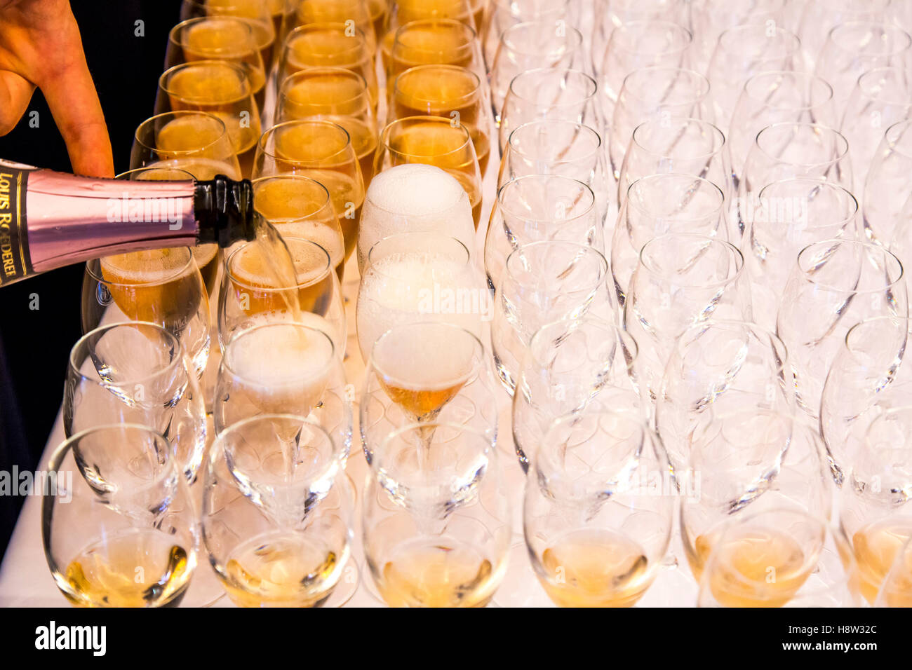 Champagne glasses, filled for the guest of an event, Stock Photo