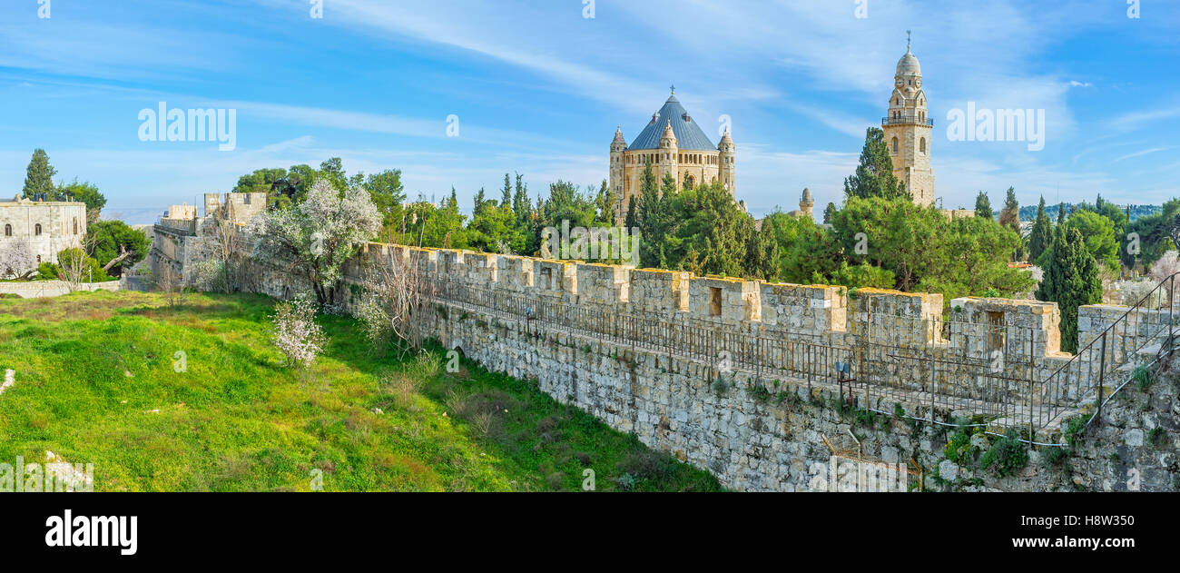 Panorama of the city wall surrounded by lush greenery with the Dormition Abbey among the pines, Jerusalem, Israel. Stock Photo
