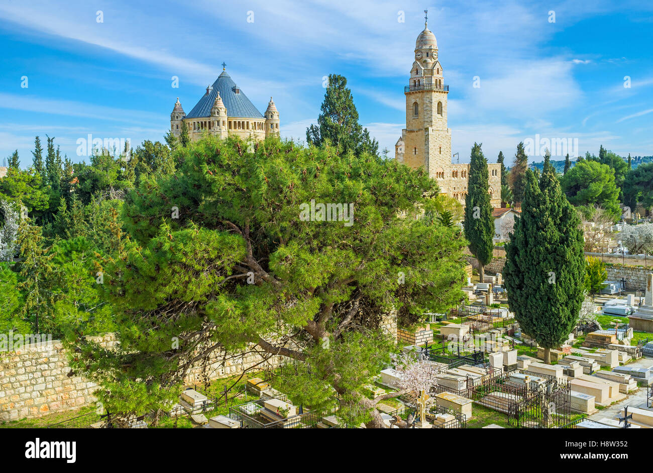 The Christian Cemetery, located on the West side of the Mount Zion with the view on Dormition Abbey on the background, Jerusalem Stock Photo