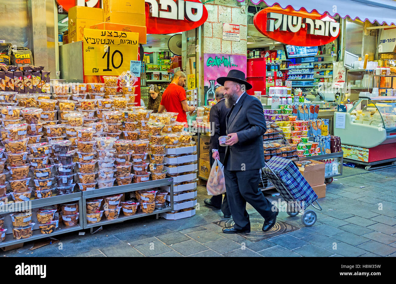 The cookies and  marshmallows in blister packs attracts the clients in Mahane Yehuda market Stock Photo