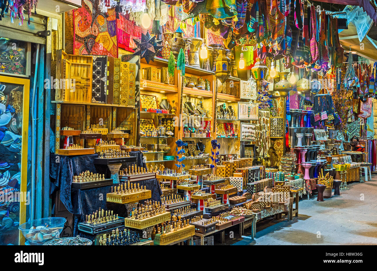 The bright illuminated stall with many diferent handmade souvenirs, Jrusalem, Israel. Stock Photo
