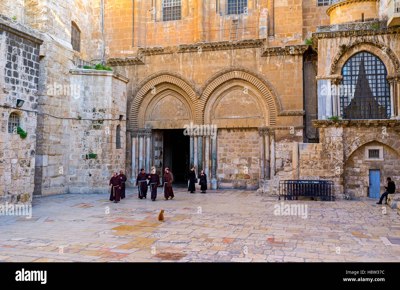 The Franciscan monks leave the Church of the Holy Sepulchre after the worship Stock Photo