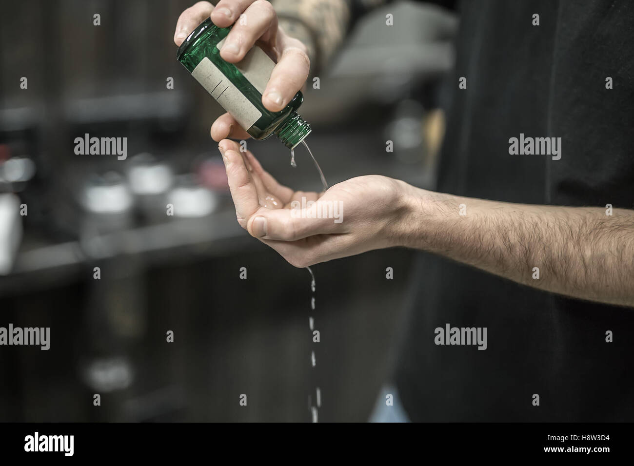 Lotion in green bottle Stock Photo Alamy