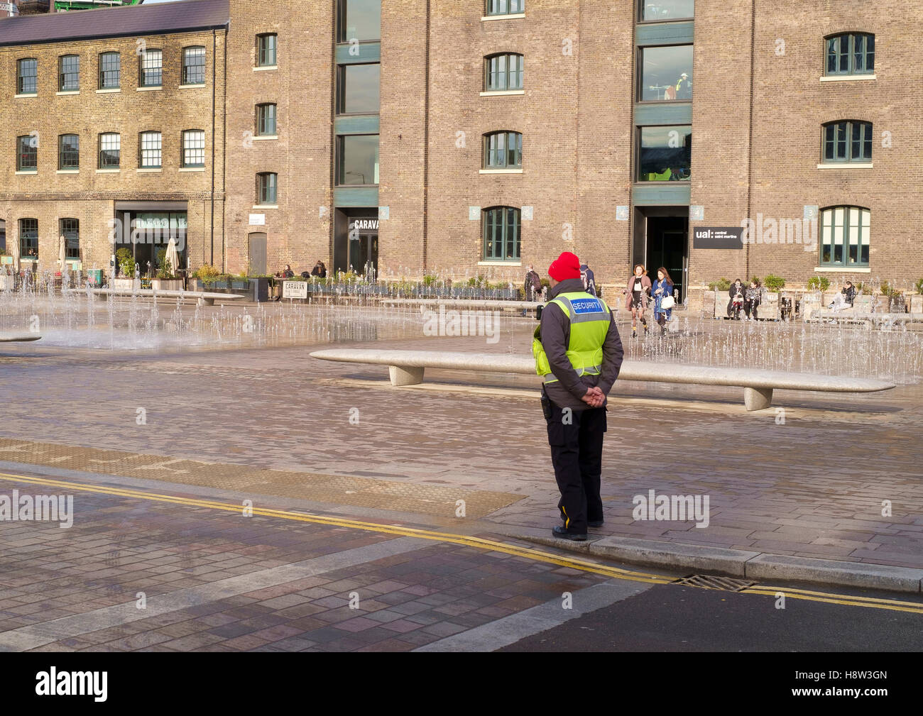 A security man at Granary Square, Kings Cross, London Stock Photo Alamy