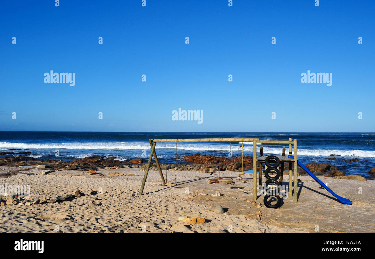 South Africa: a wooden swing on the beach of Mossel Bay, the harbour town on the Southern Cape, along the famous Garden Route Stock Photo