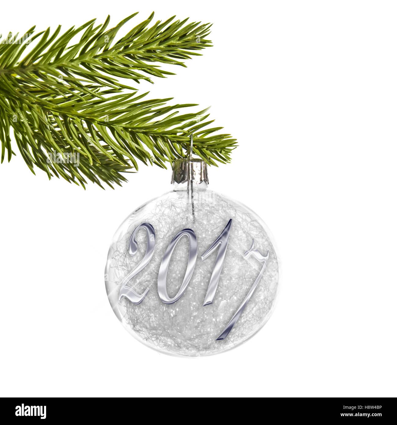 2017 on a silver christmas ball hanging from a branch isolated on white Stock Photo