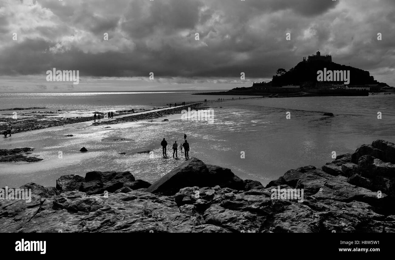 People walking across the causeway to St Michael's Mount at low tide
