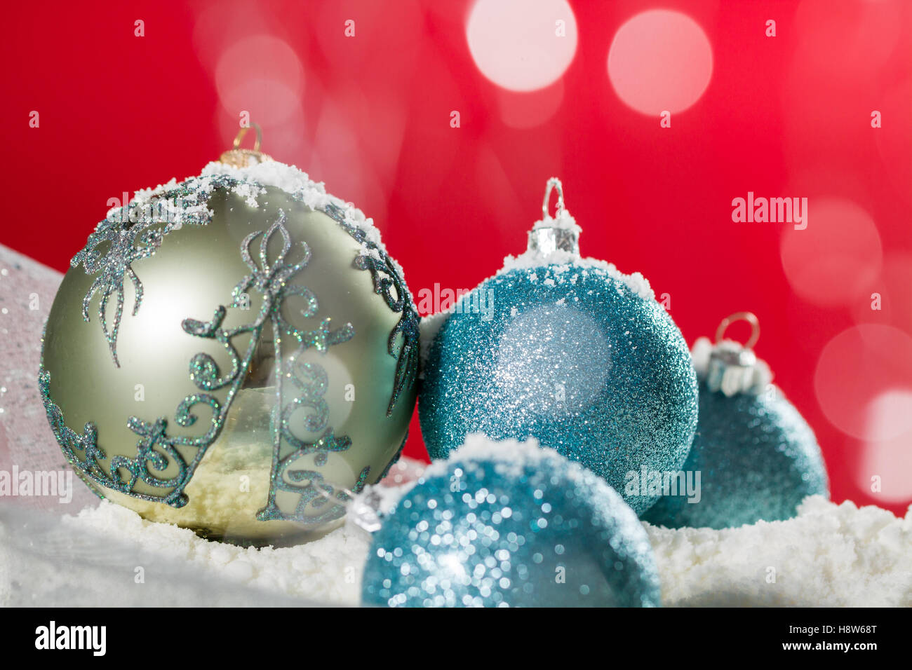 Christmas ball on snow and silver glitter background Stock Photo