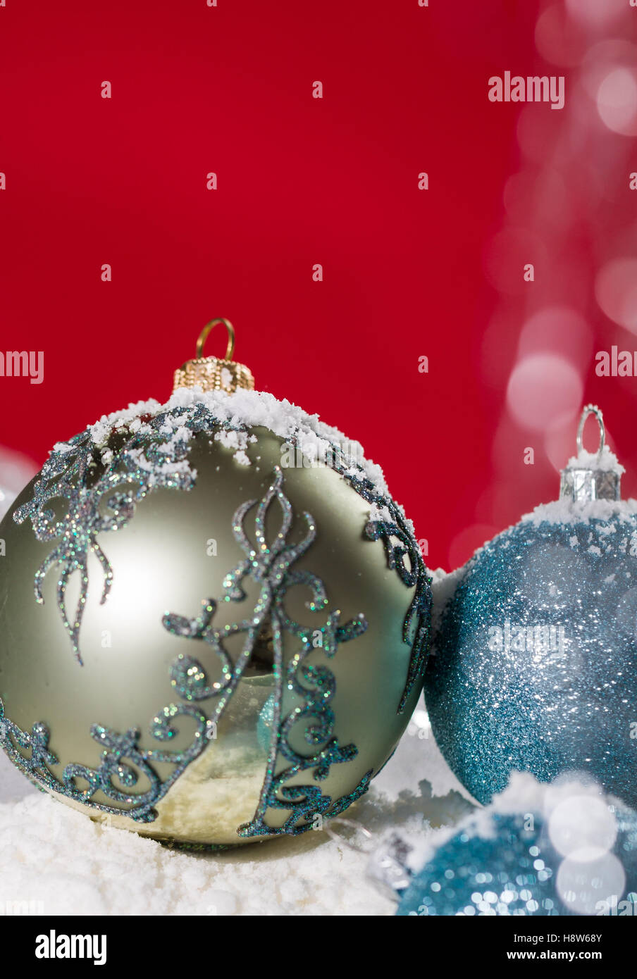 Christmas ball on snow and silver glitter background Stock Photo