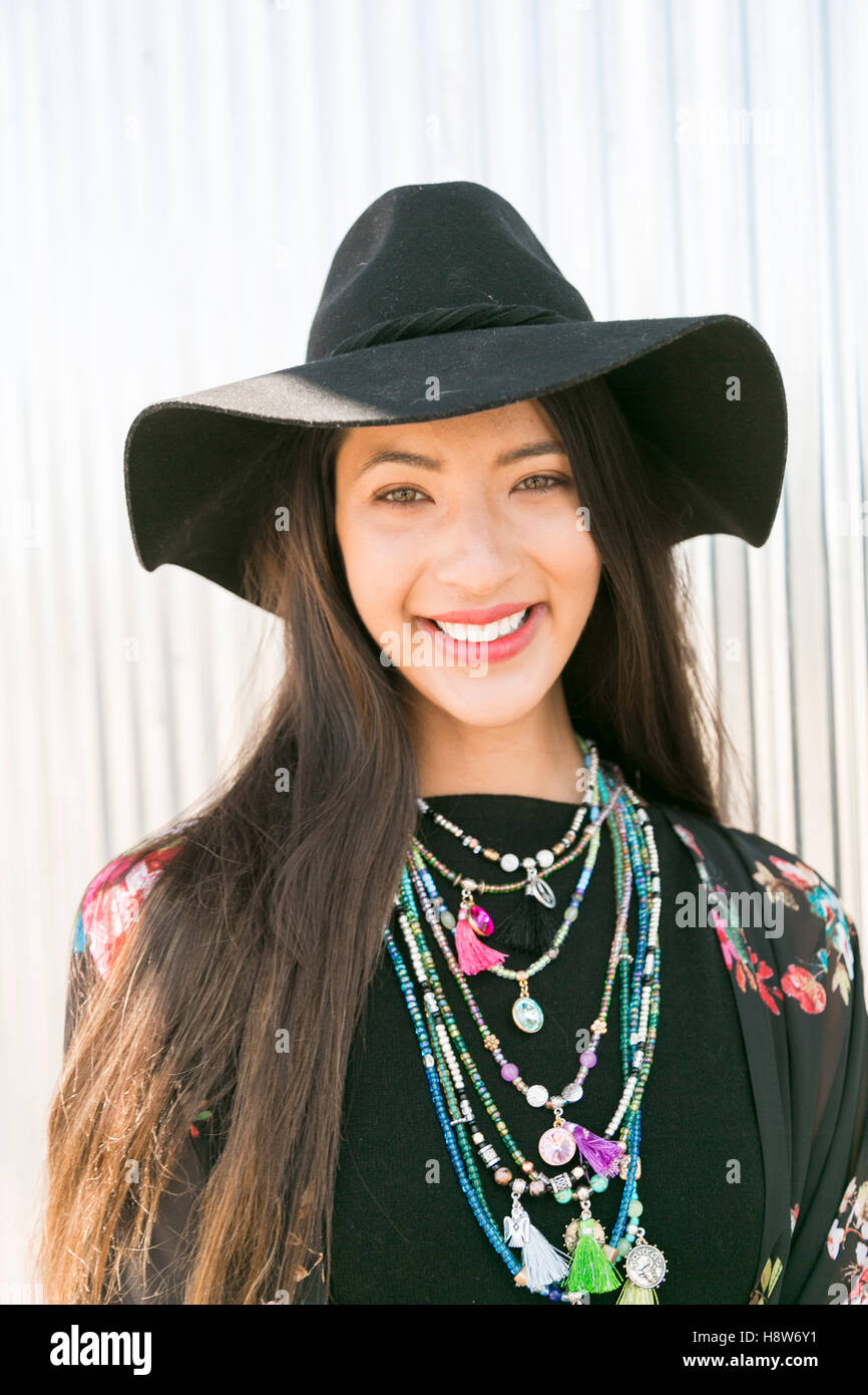 Smiling bohemian girl in floppy hat Stock Photo