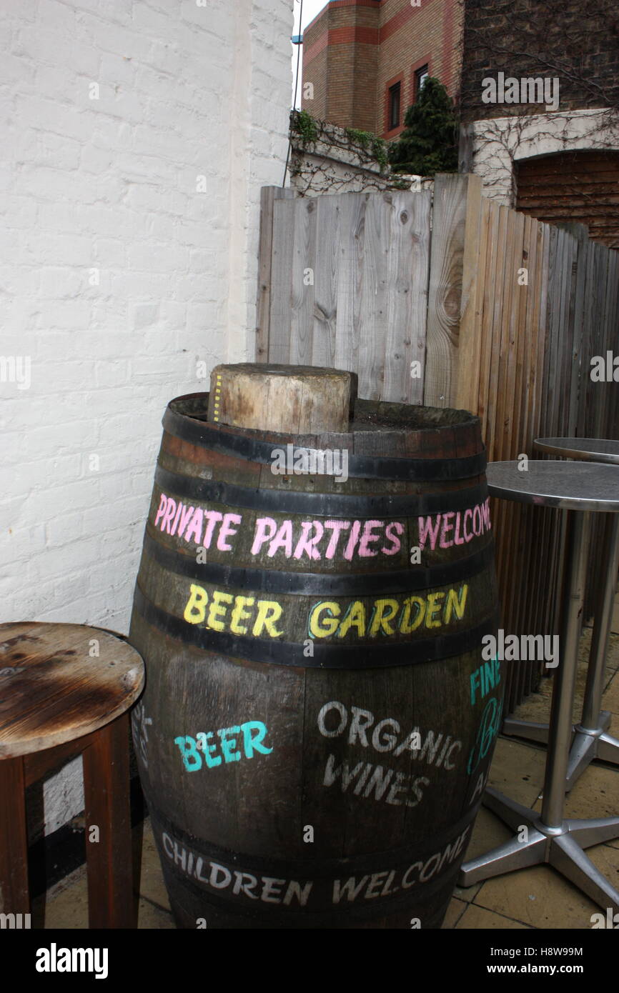 Beer barrel in a New Cross London pub 'private parties welcome' beer garden (pub now closed). Stock Photo