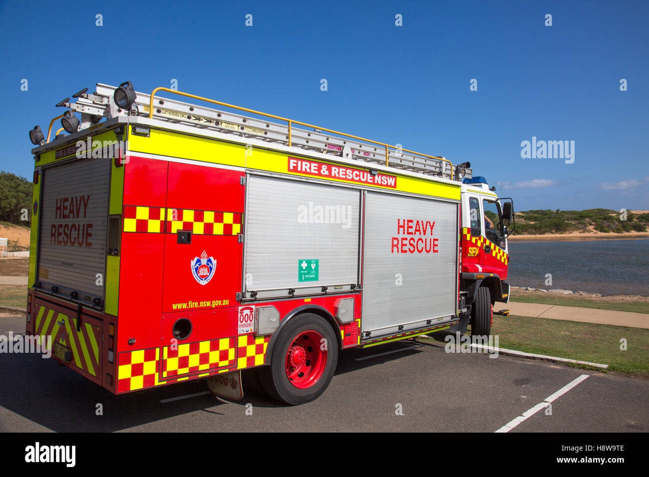 New south wales fire service truck tender engine parked by narrabeen lagoon on Sydney northern beaches,Australia Stock Photo