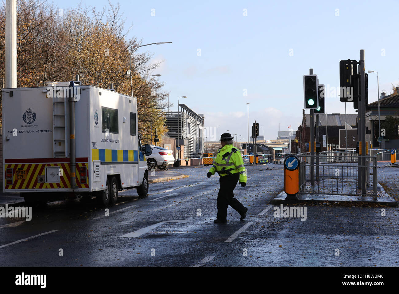 Police at the scene where a man died after being shot as he sat in a ...