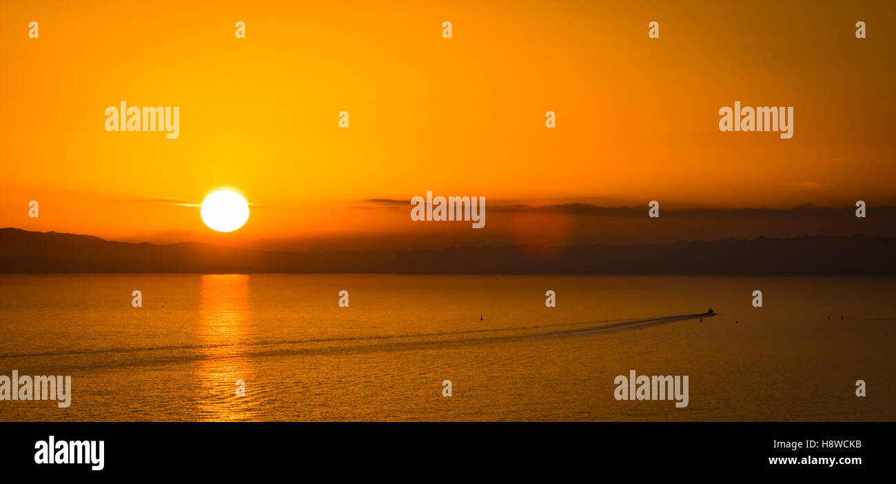 Sunset over Poole Bay in Bournemouth Stock Photo