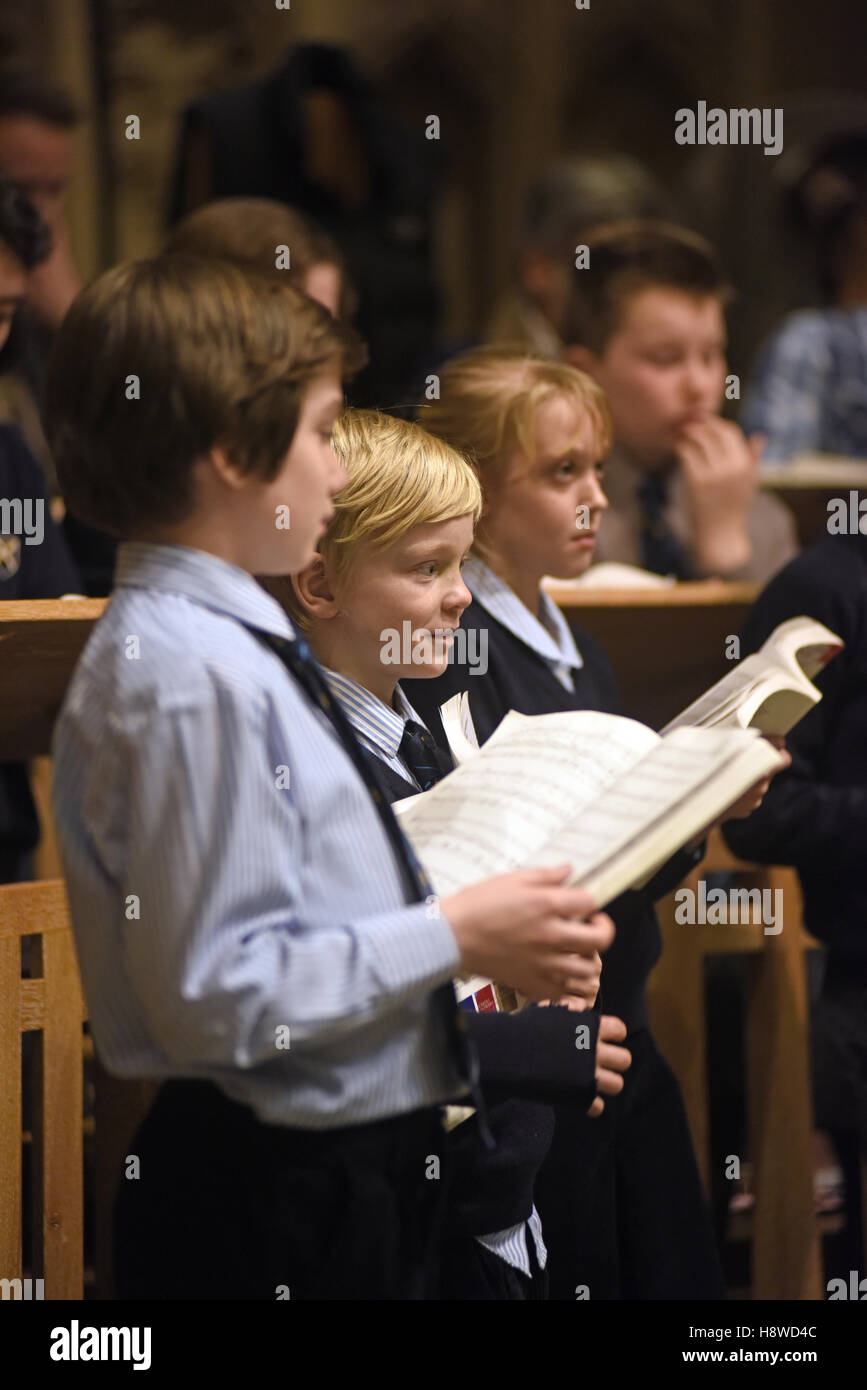 Choristers being conducted by choir master at a recording session for a commercial CD production. Wells Cathedral Choir. Stock Photo