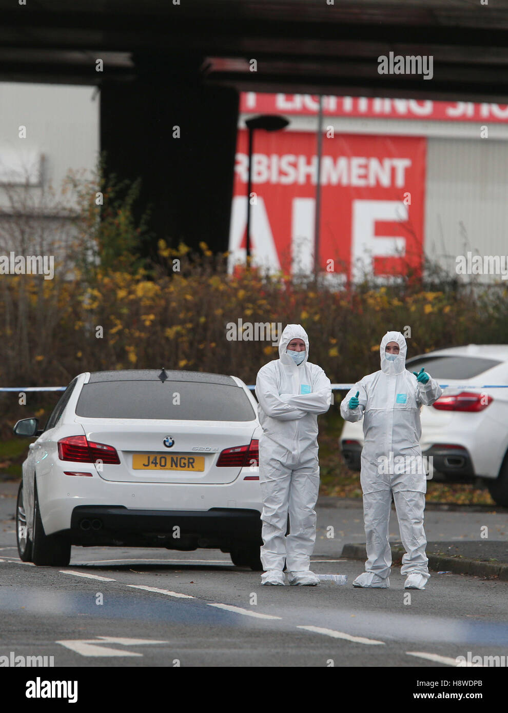 Police forensic officers at the scene where a man died after being shot ...