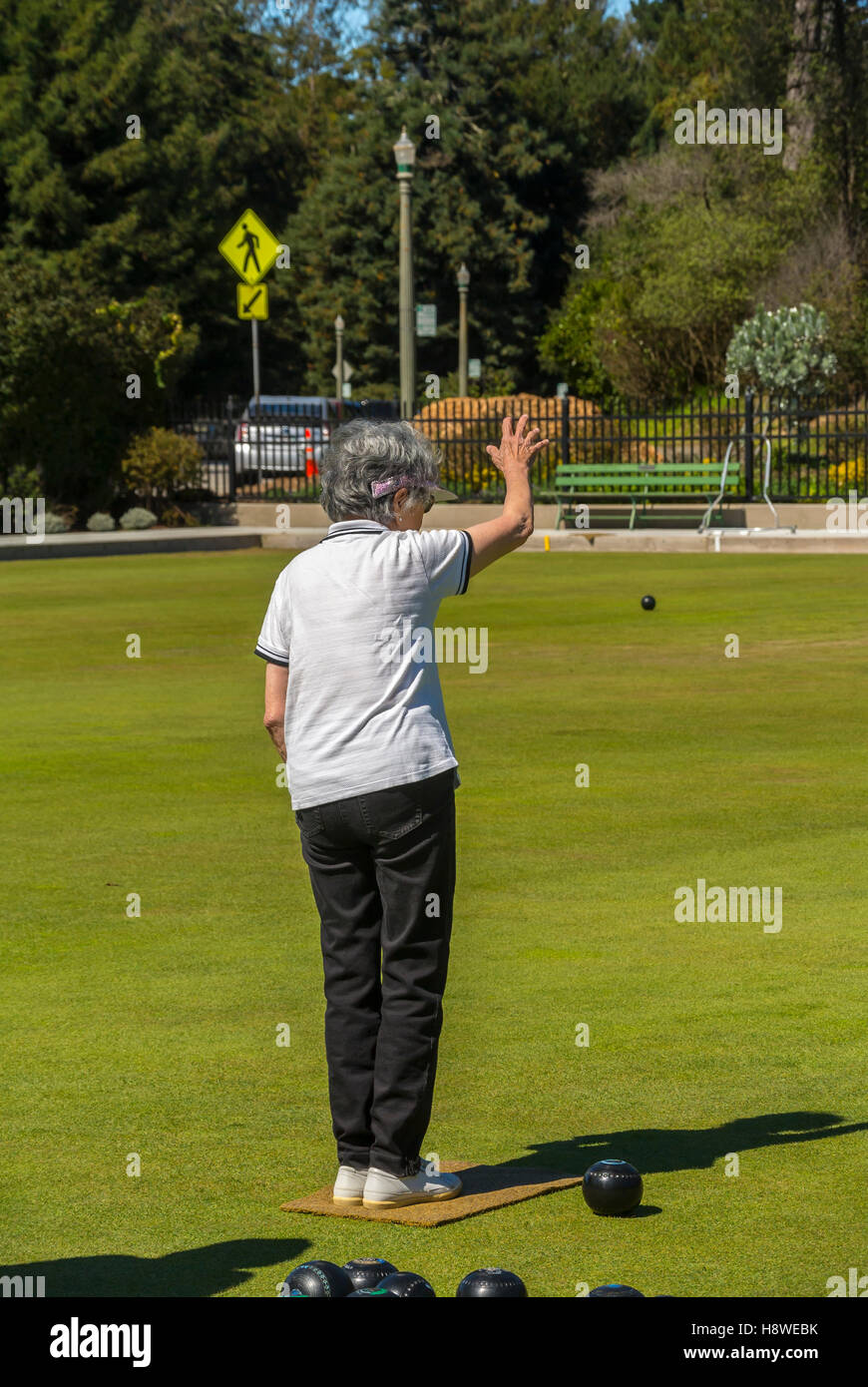 San Francisco, CA, USA, Senior Woman from behind, standing, Playing Lawn Bowling, Bocce Ball Game, Golden Gate Park, Grassy Field, 65-80 years sport Stock Photo