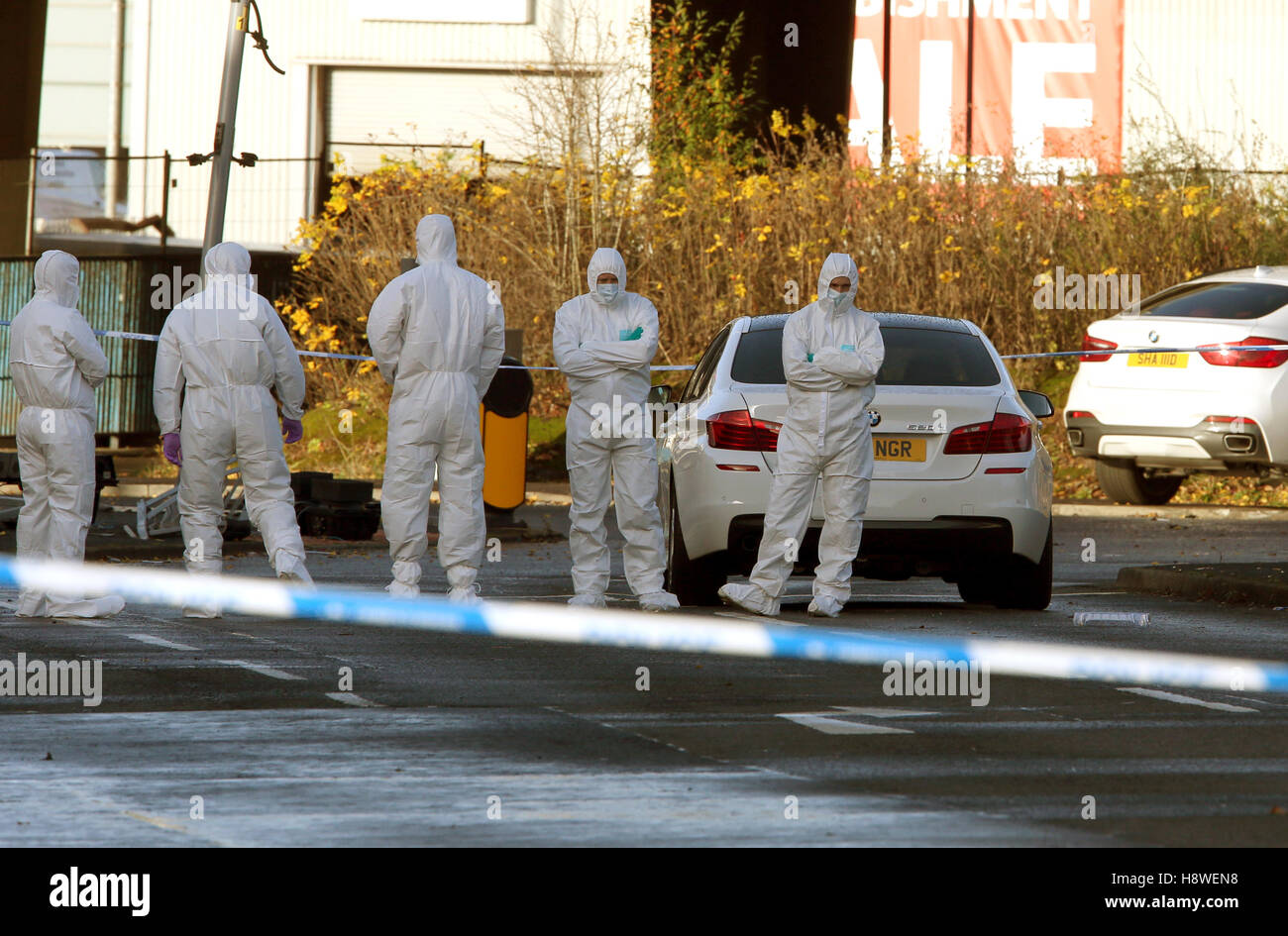 Police forensic officers at the scene where a man died after being shot ...