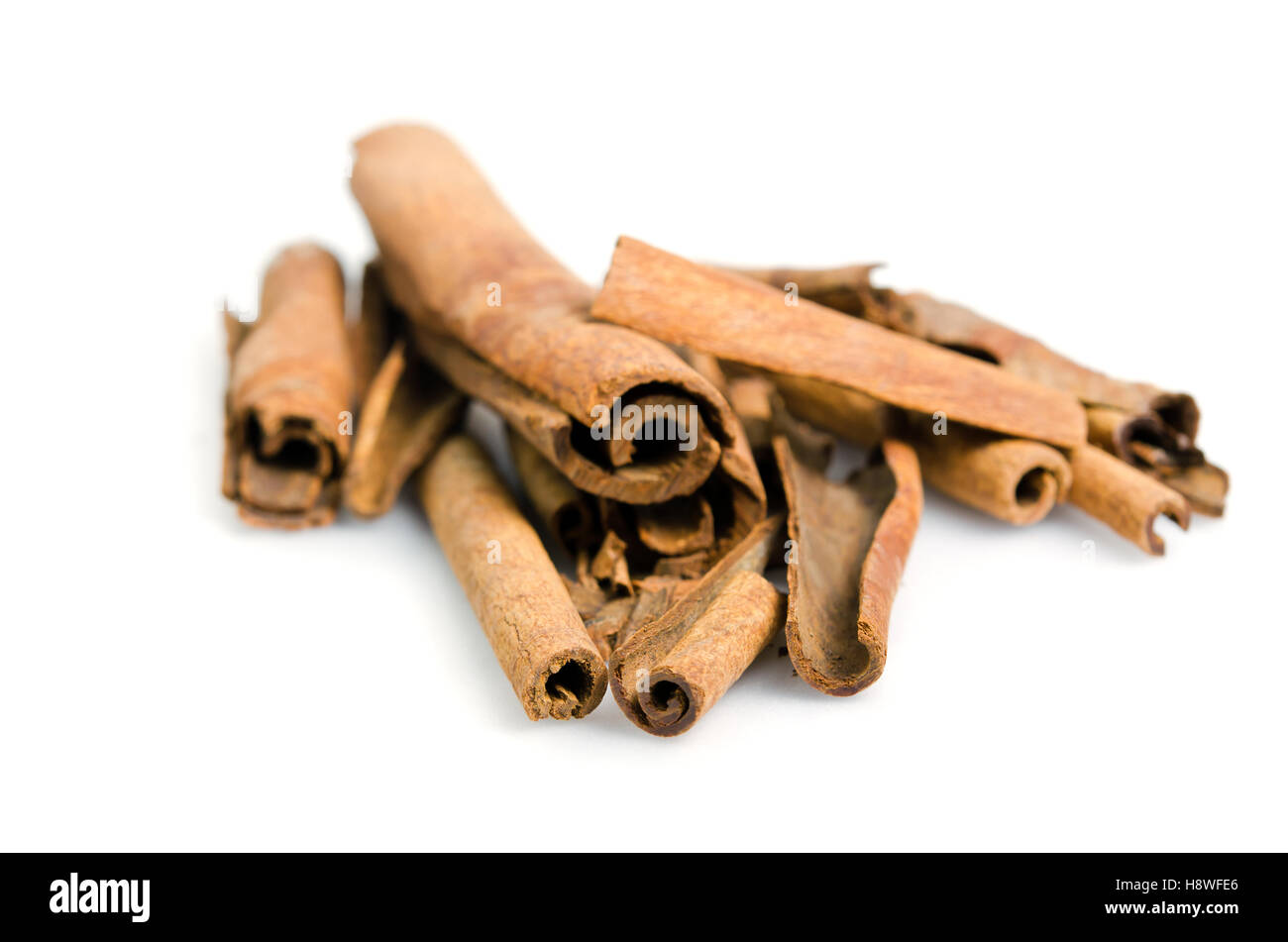 Cinnamon sticks (Also named as Cinnamomum, Cinnamomum verum, cassia, Lauraceae cinnamon, or kinnamon in Greek) on wood backgroun Stock Photo