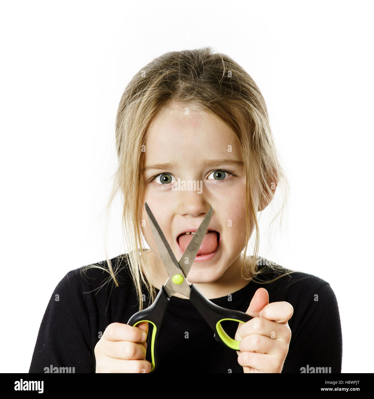Cute little girl with scissors. Self hairdresser, isolated on white ...