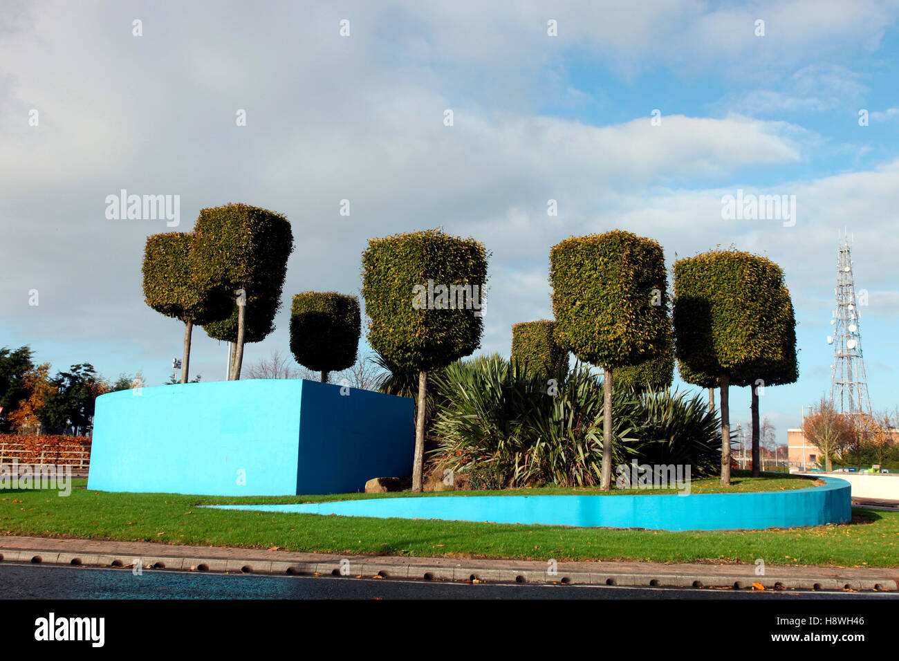 Topiary on a landscaped traffic island, Dundalk Stock Photo