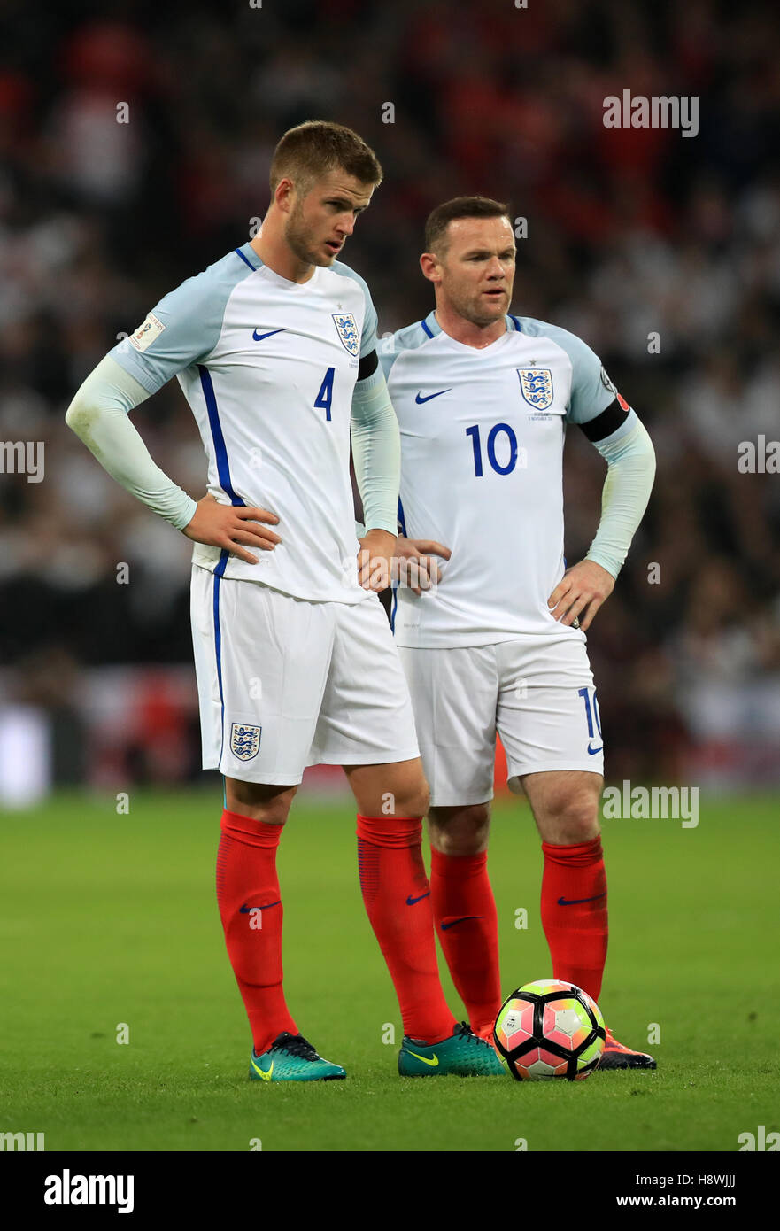 (left-right) England's Eric Dier and Wayne Rooney during the 2018 FIFA World Cup qualifying, Group F match at Wembley Stadium, London. Stock Photo