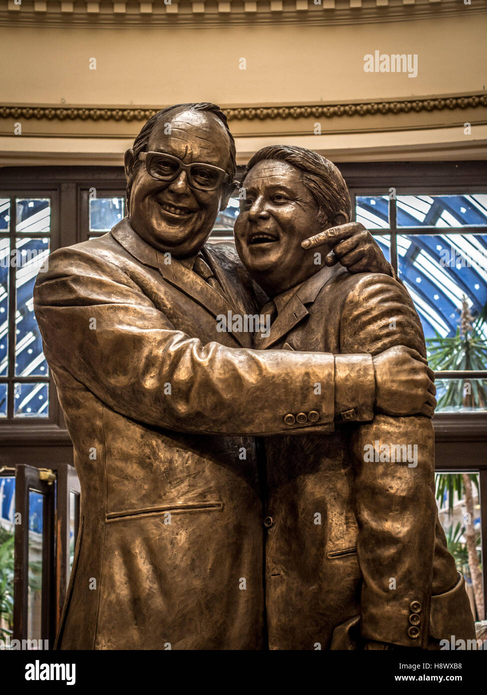 Statue of Eric Morecambe and Ernie Wise by Graham Ibbeson in the domed entrance of Blackpool’s Winter Gardens, Lancashire, UK. Stock Photo