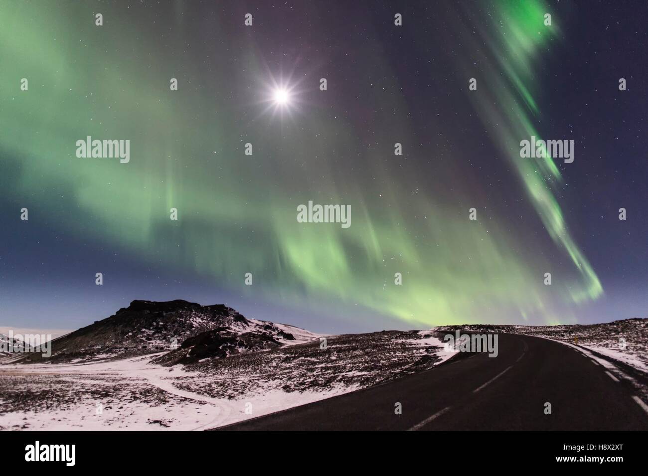 Northern lights and full moon in the Reykjanes Peninsula Iceland