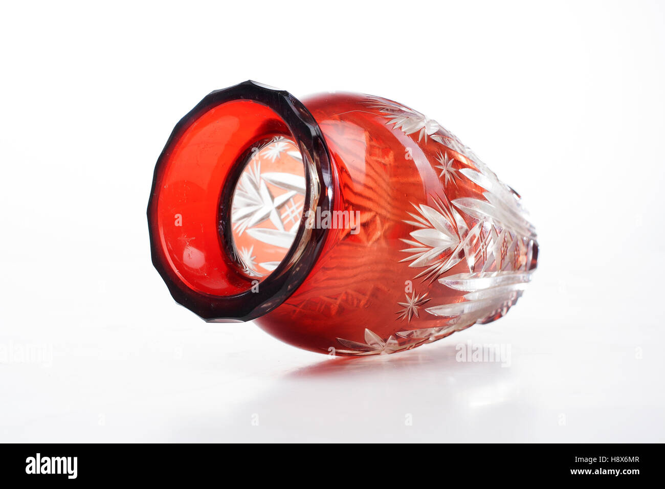 Expensive crystal vase. Red glass cystal vase in white isolated studio