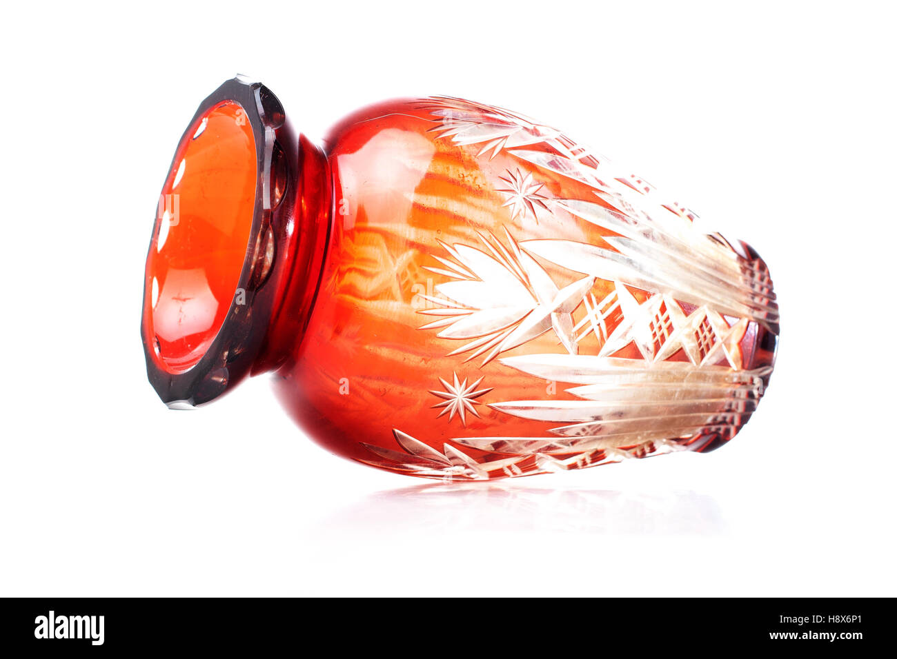Expensive crystal vase. Red glass cystal vase in white isolated studio background. For any