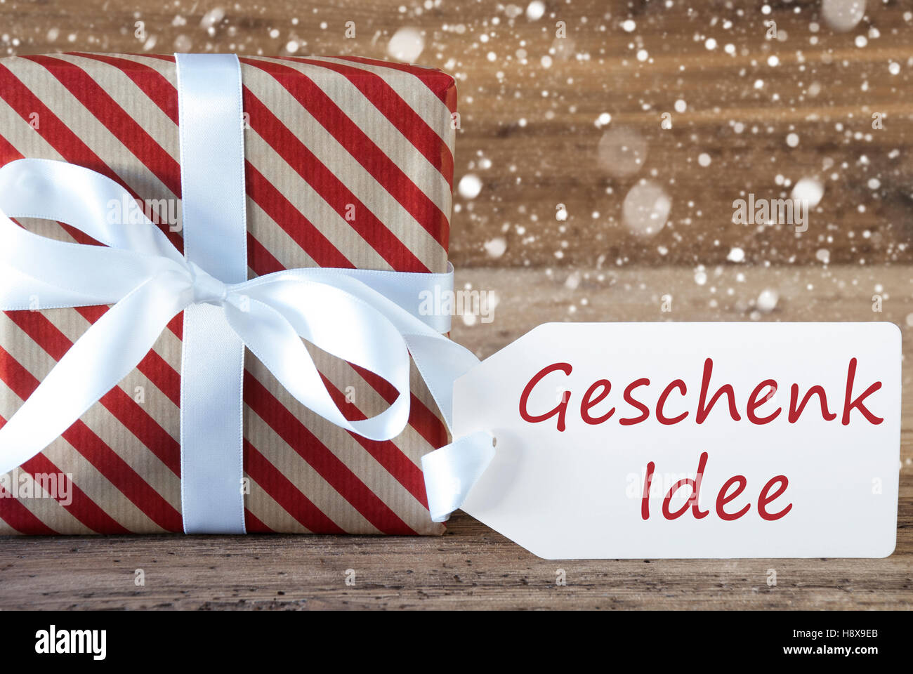 Present With Snowflakes, Text Geschenk Idee Means Gift Idea Stock Photo