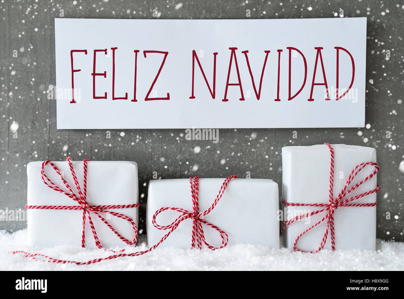 White Gift With Snowflakes, Feliz Navidad Means Merry Christmas Stock Photo