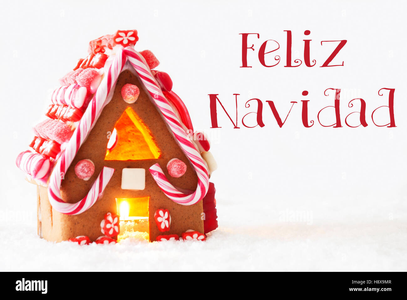 Gingerbread House, White Background, Feliz Navidad Means Merry Christmas Stock Photo