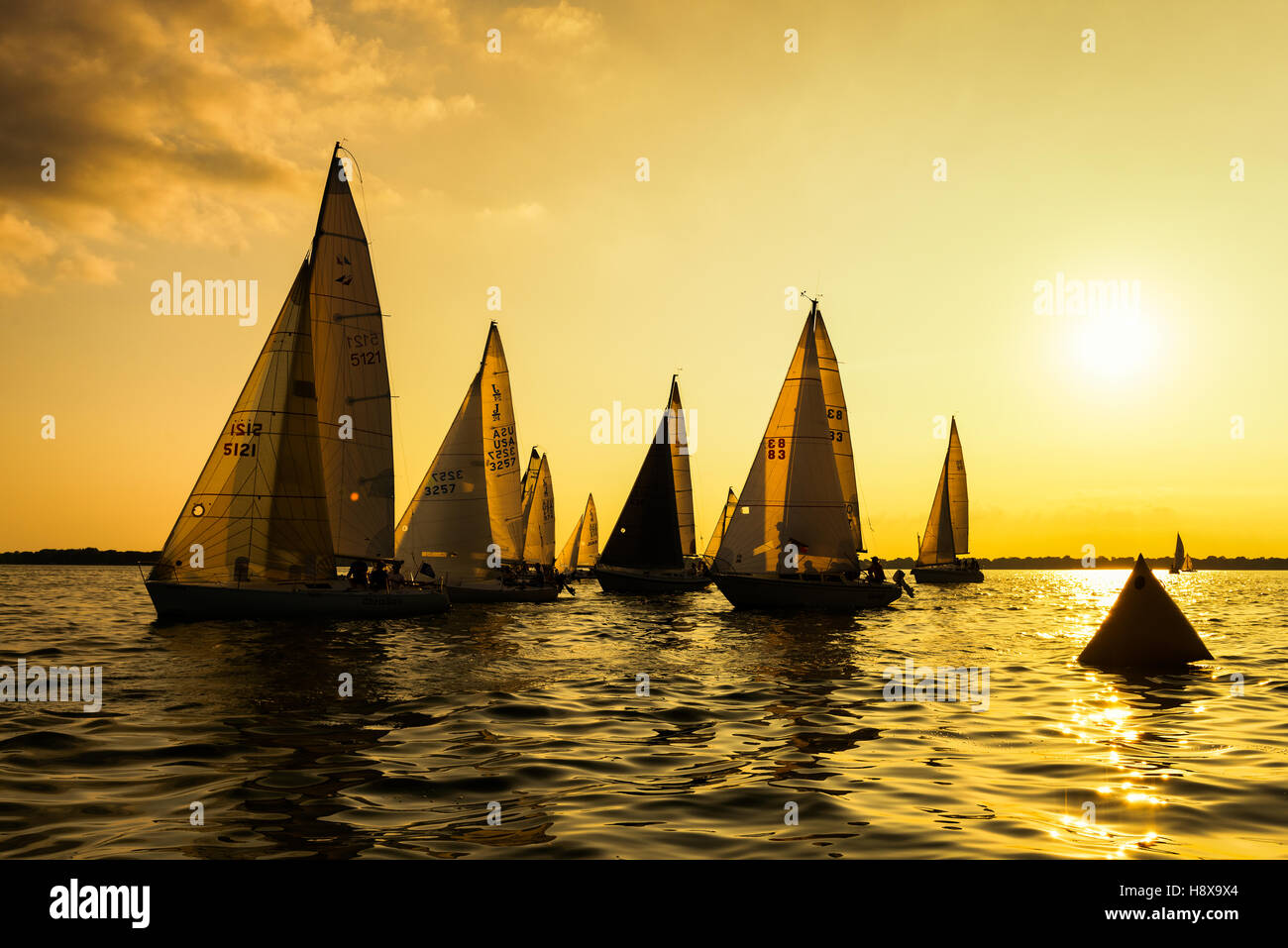 Neenah, WI - 2 August 2016:  Sailboats race in a seasonal race held every Tuessday evening during the summer Stock Photo