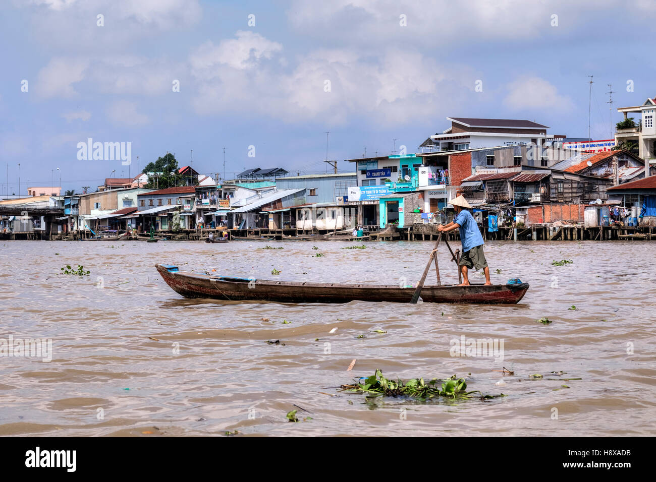 Man rowing sampan boat on the Mekong River in Cai Be, Mekong Delta, Vietnam, Asia Stock Photo